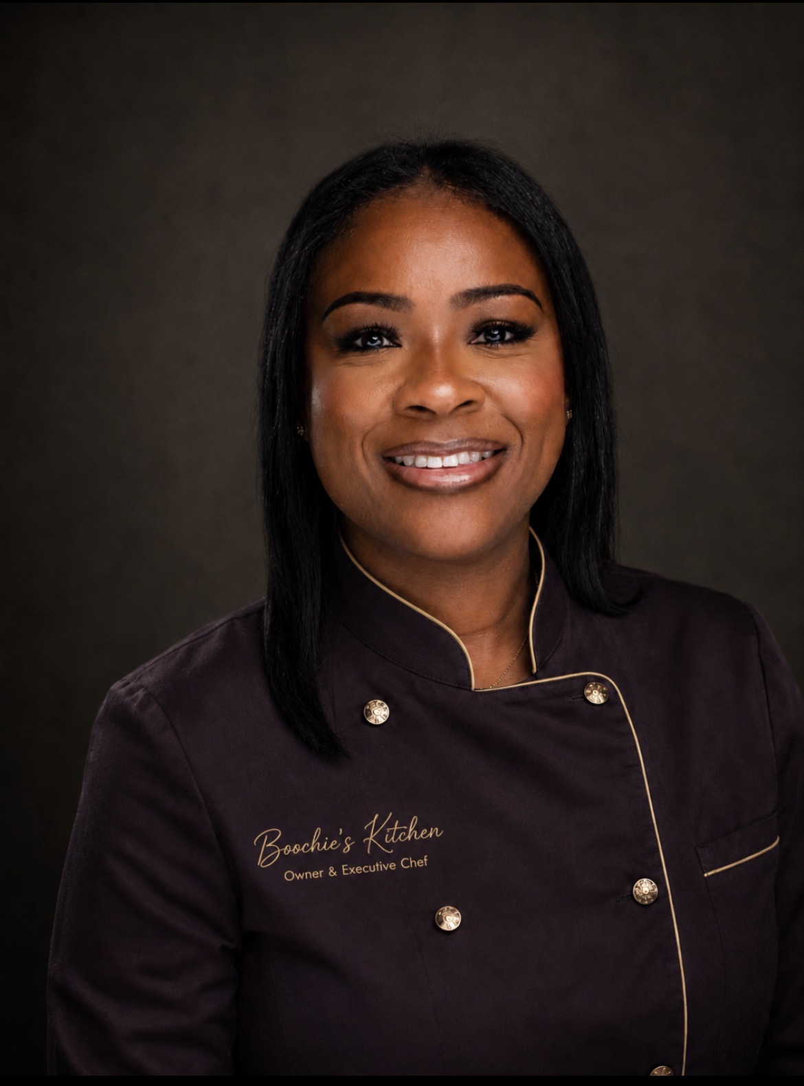 Erica Scott, Owner and Executive Chef of Boochie’s Kitchen, in her chef coat